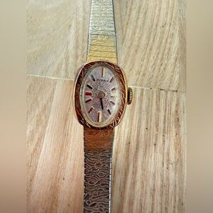 Vintage Timex ladies oval gold tone mechanical winding watch